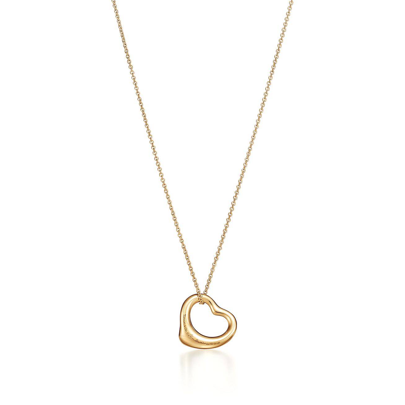 TIFFANY  ELSA PERETTI® OPEN HEART PENDANT IN YELLOW GOLD WITH RUBIES, 16 MM